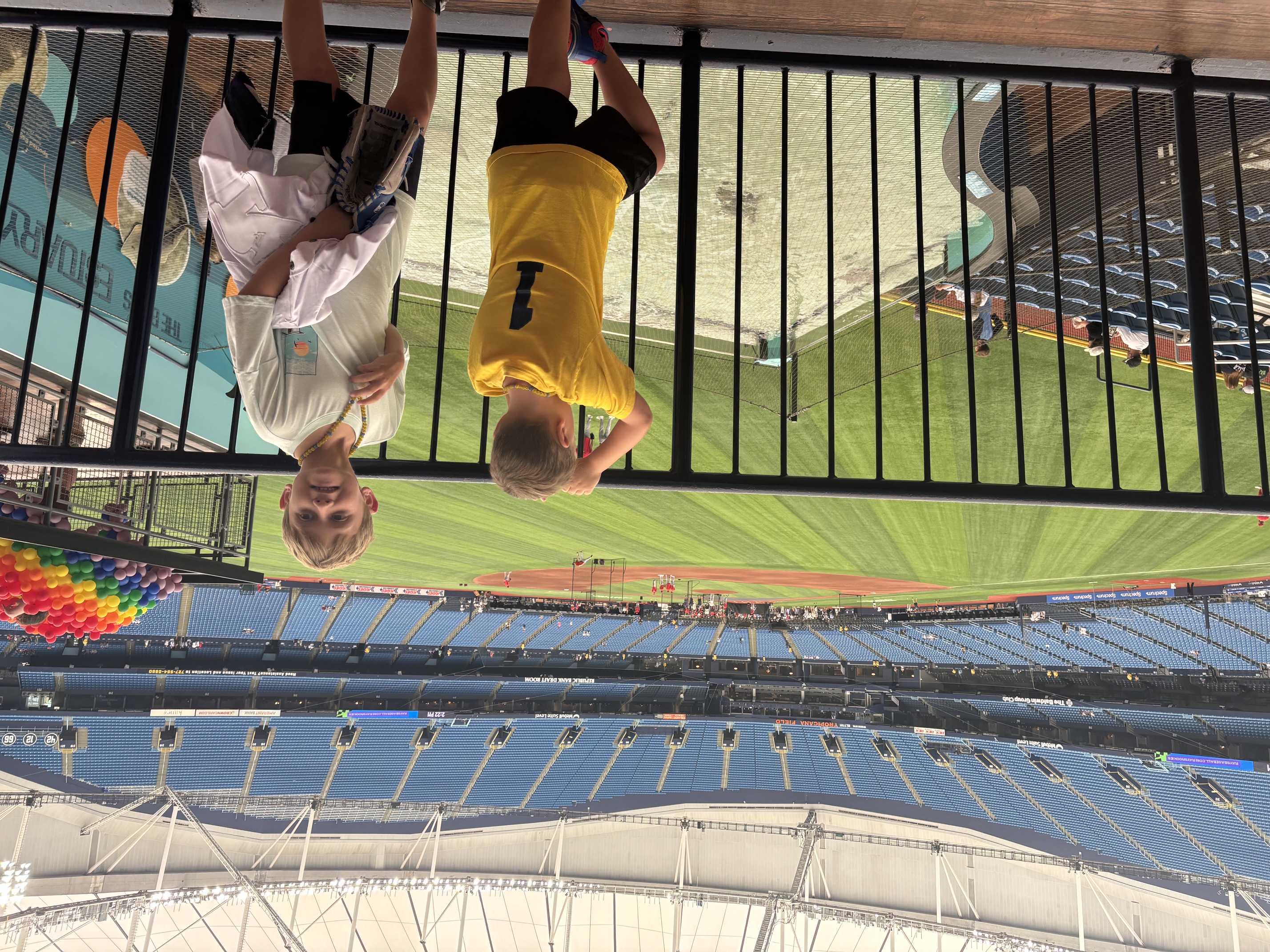 The boys at the outfield railing overlooking Tropicana Field